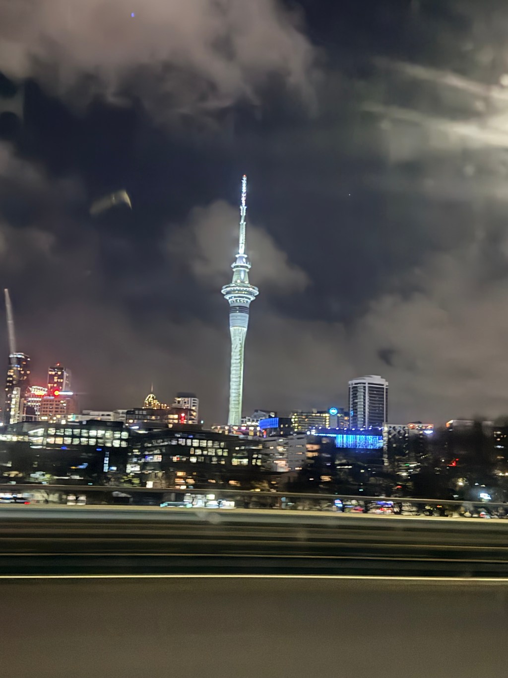 Auckland skyline at night taken from the window of a moving vehicle