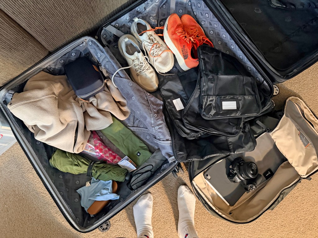 open suitcase showing various items