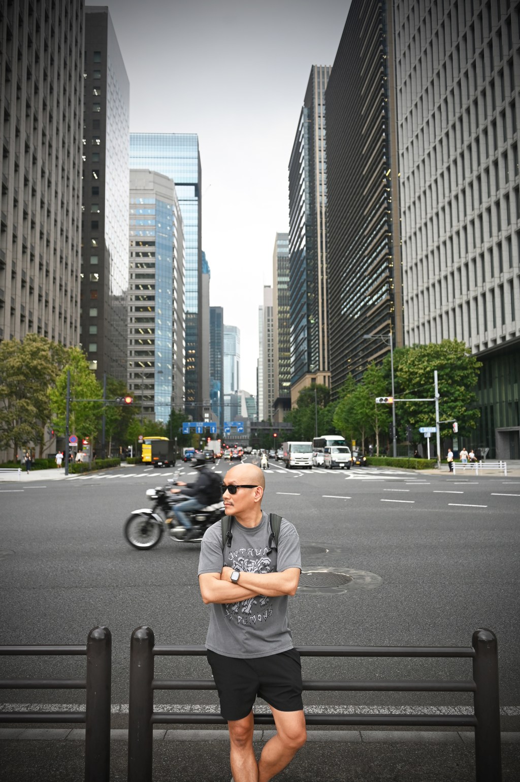 Ryan amor posing in front of the Tokyo Imperial gardens